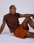 Pleated Trouser Shorts in Burnt Terracotta and Organic Vintage Tee in Fudgesicle Brown on Jerrod