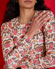 Front close up of Long Sleeve Baby Tee in Hot Stuff Print on Shahana