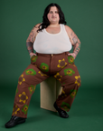 Floral Painted Work Pants in Brown and Tank Top in Vintage Tee Off-White worn by Sam