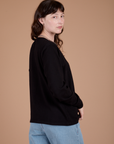 Long Sleeve Burly Tee in Basic Black side view on Alex