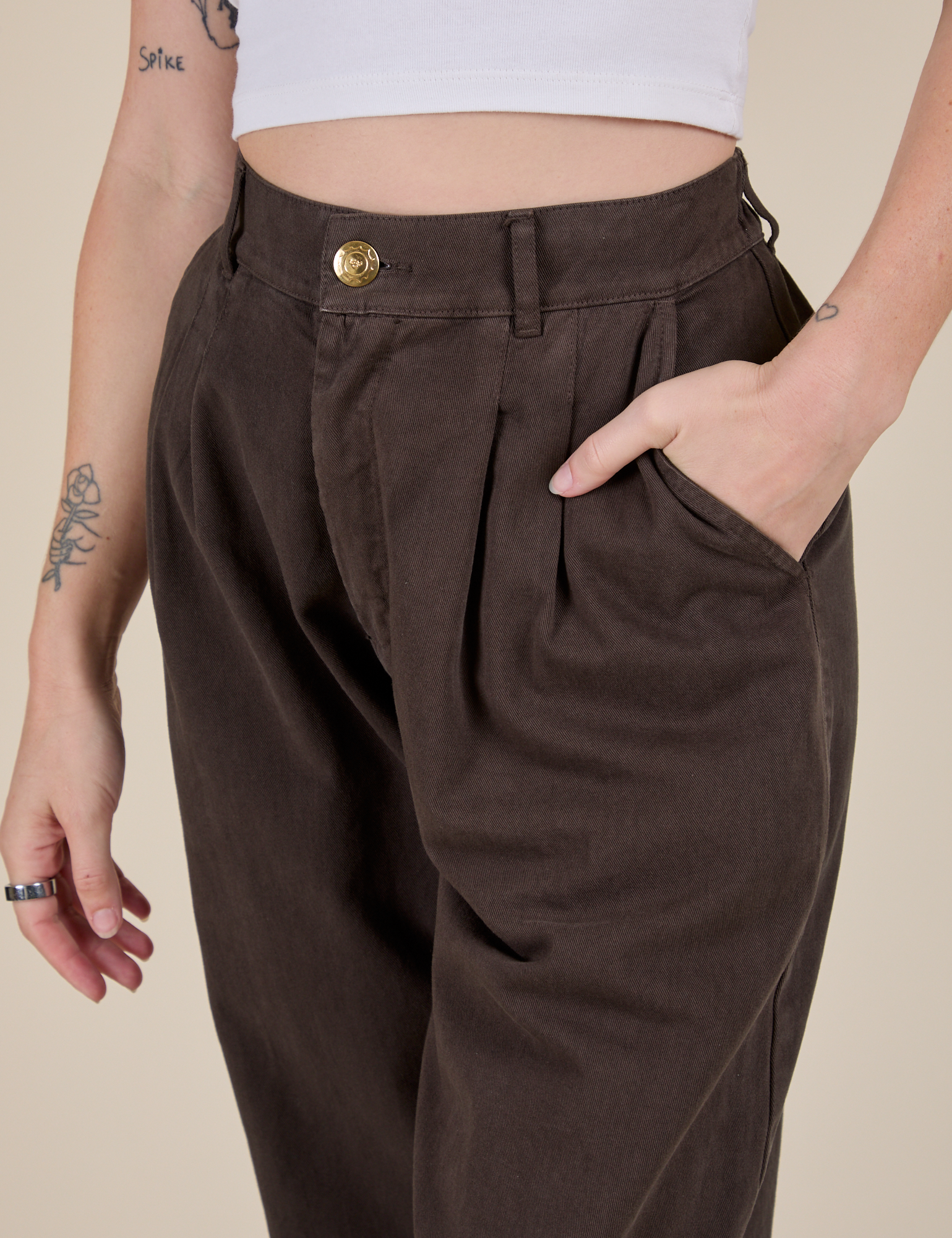 Close up of Alex's hand in the front pocket of Heavyweight Trousers in Espresso Brown