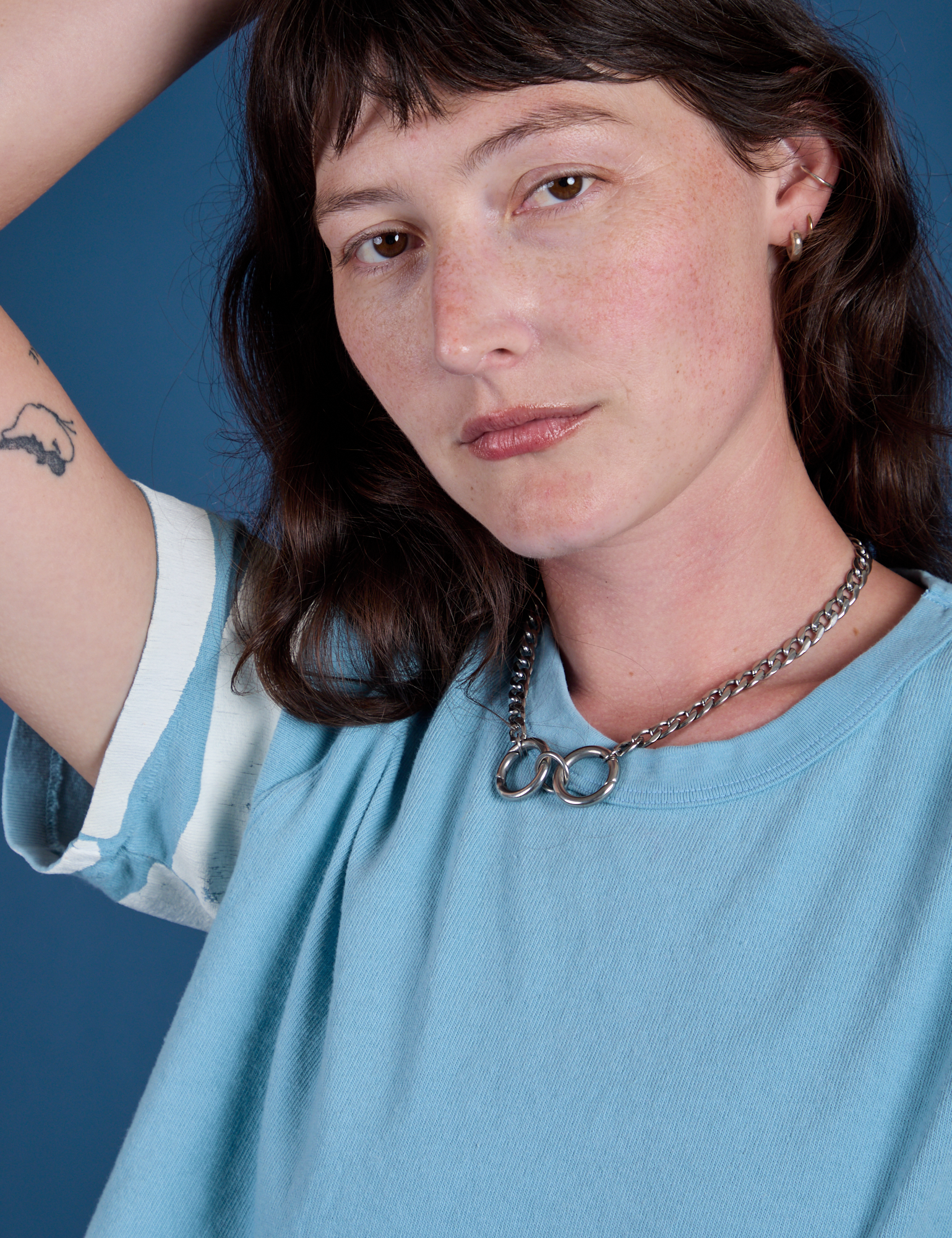 Painted Burly Tee in Baby Blue close up on Alex