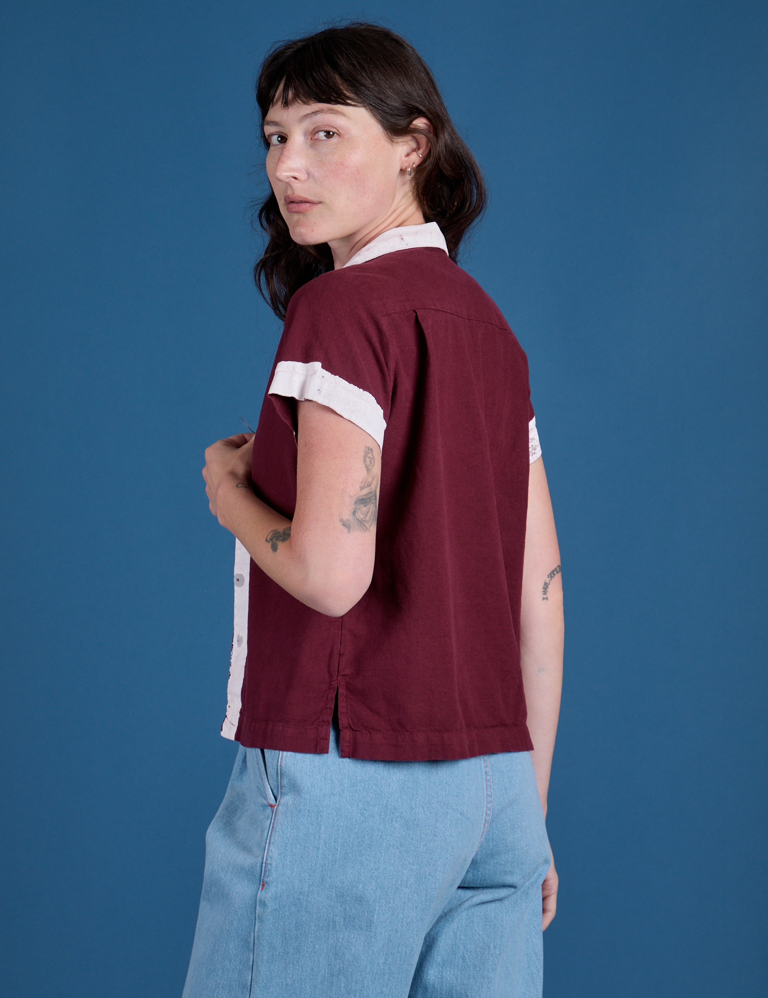 Angled back view of Painted Pantry Button-Up in Red Wine on Alex