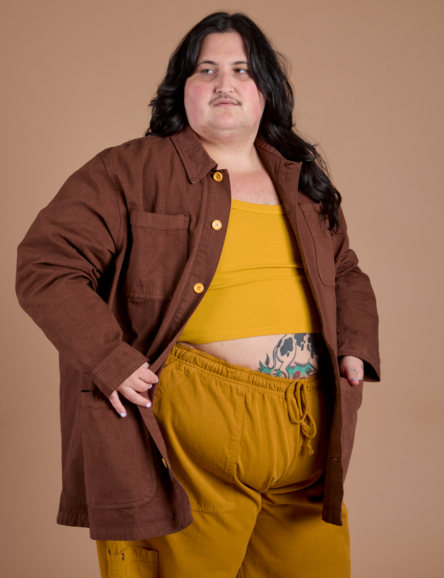 Angled front view of Ripstop Field Coat in Fudgesicle Brown on Sam