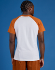 Back view of Produce Raglan Tee in Orange on Isaac