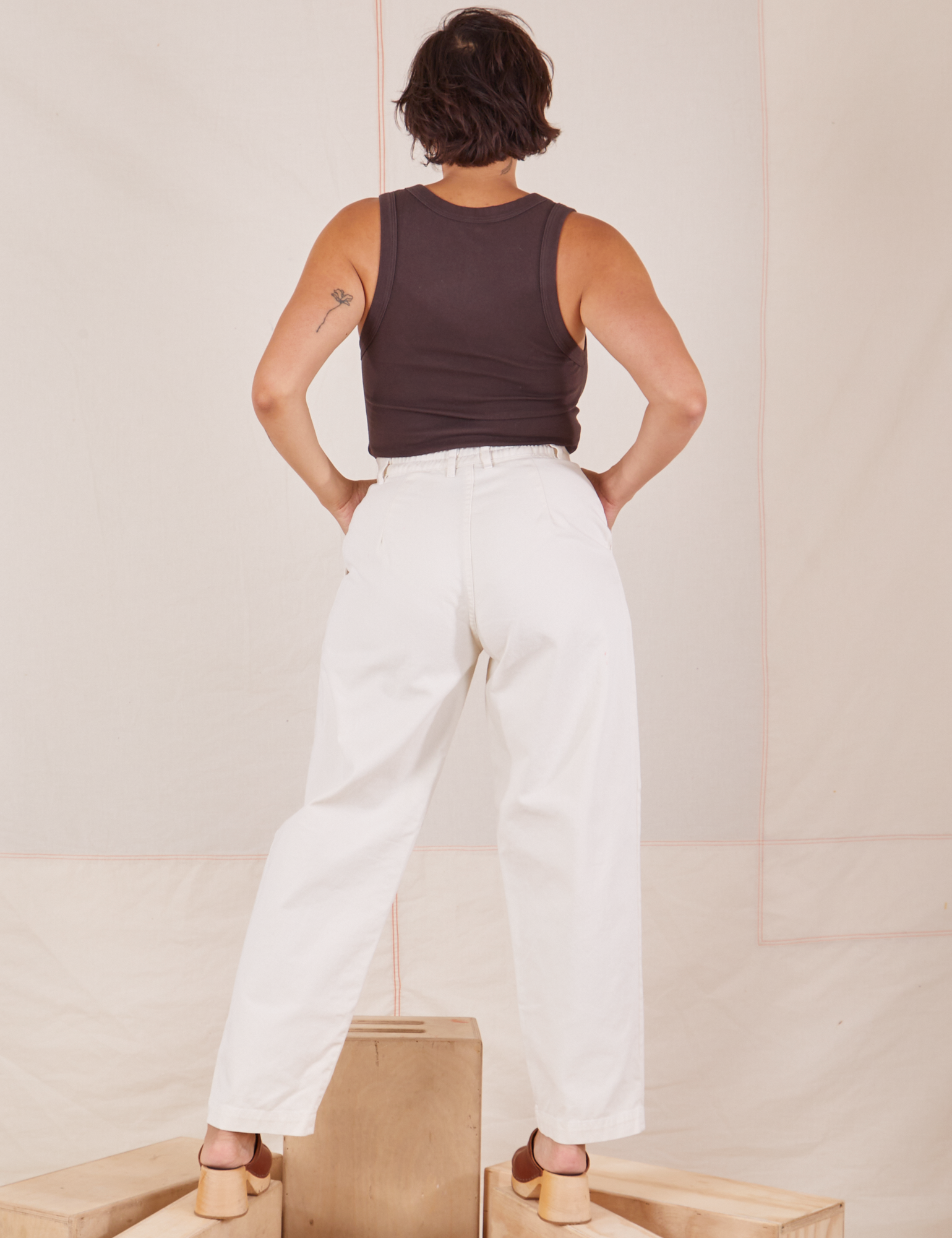 Back view of Heavyweight Trousers in Vintage Tee Off-White and espresso brown Cropped Tank Top worn by Tiara.