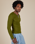 Long Sleeve Baby Tee in Summer Olive side view on Jerrod