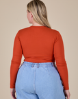 Long Sleeve Baby Tee in Chili Red back view on Lish