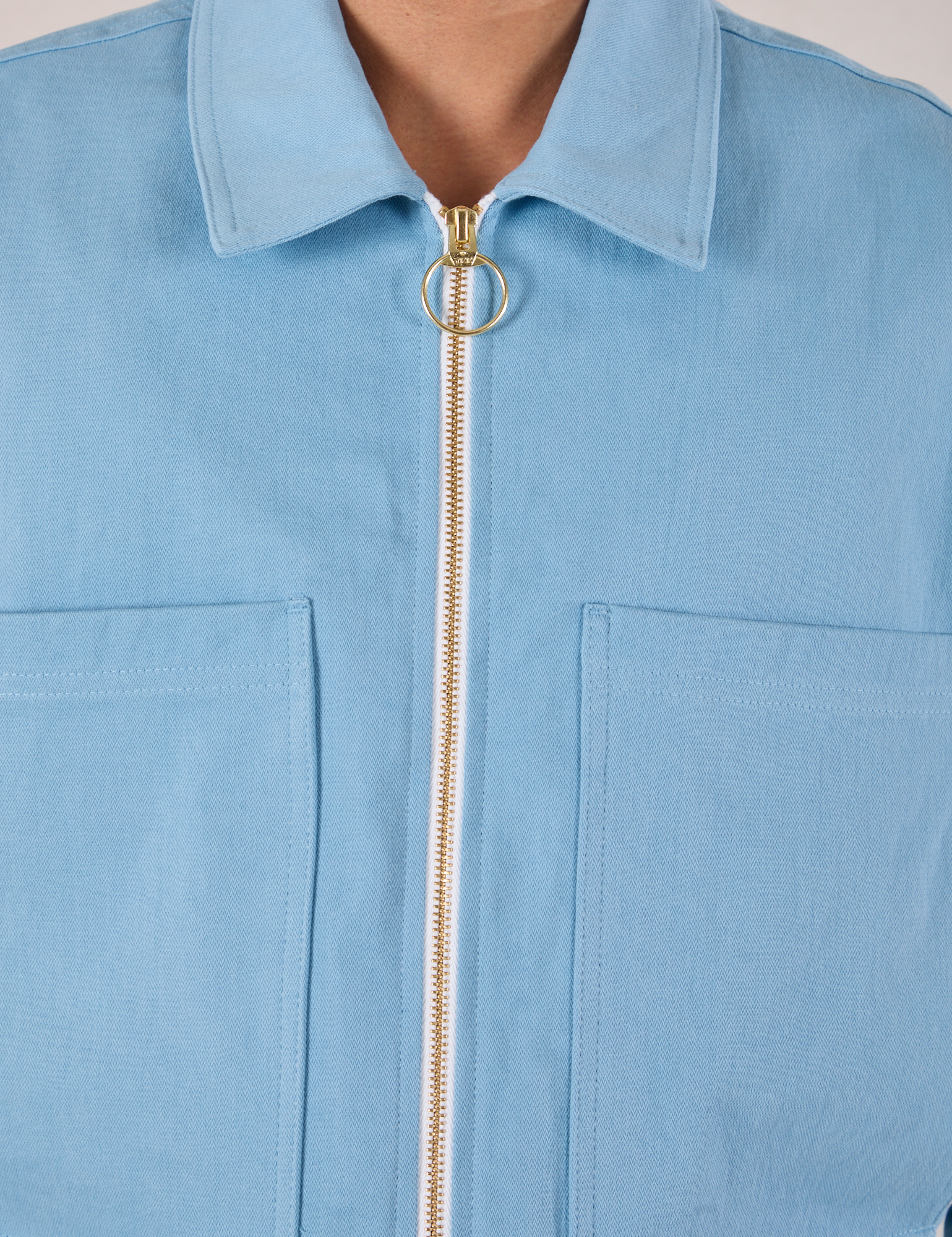 Mechanic Jacket in Baby Blue close up of brass zipper