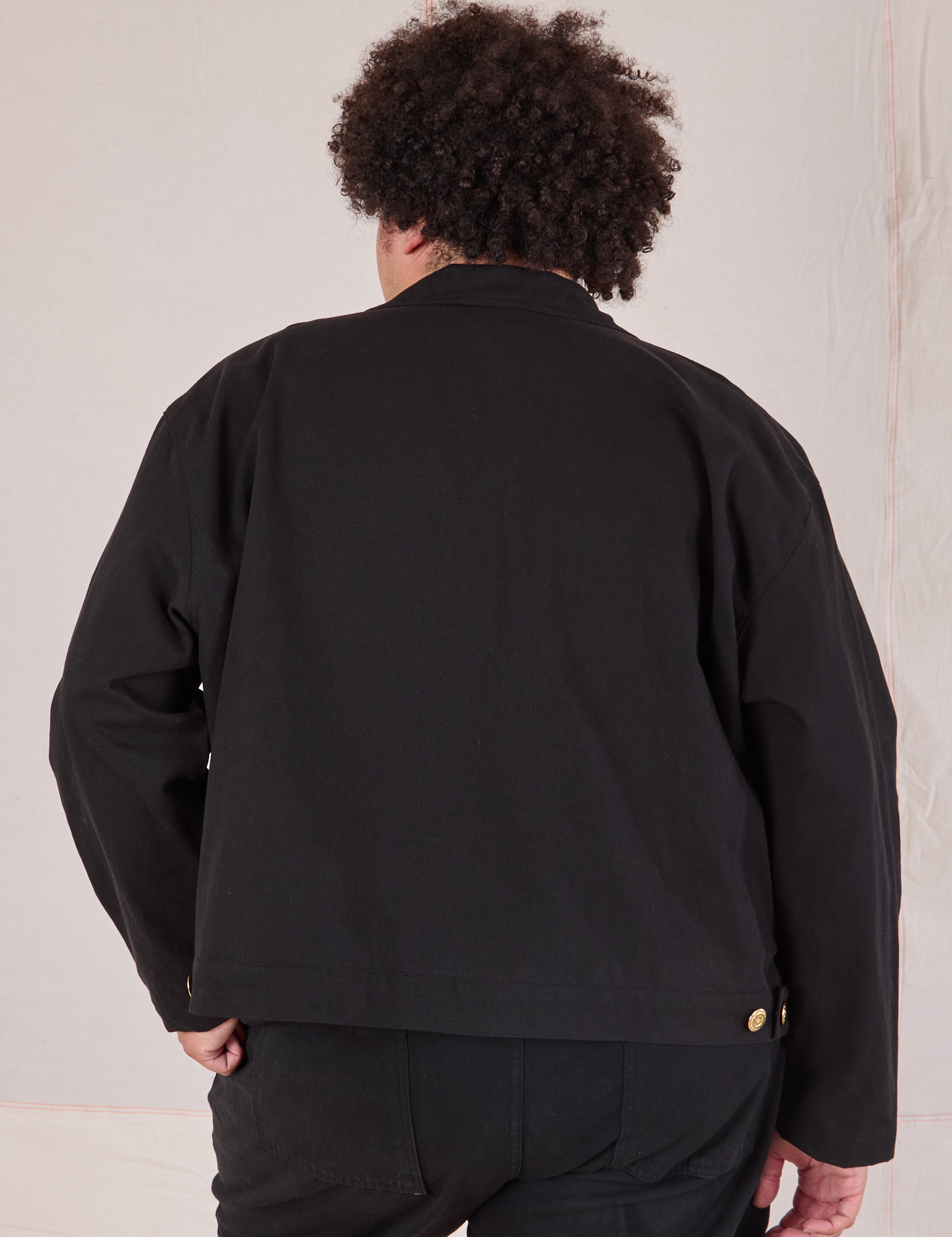 Mechanic Jacket in Basic Black back view on Miguel