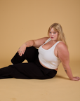 Baggy Mid-Rise Trousers in Basic Black and vintage tee white Cropped Tank worn by Juliet