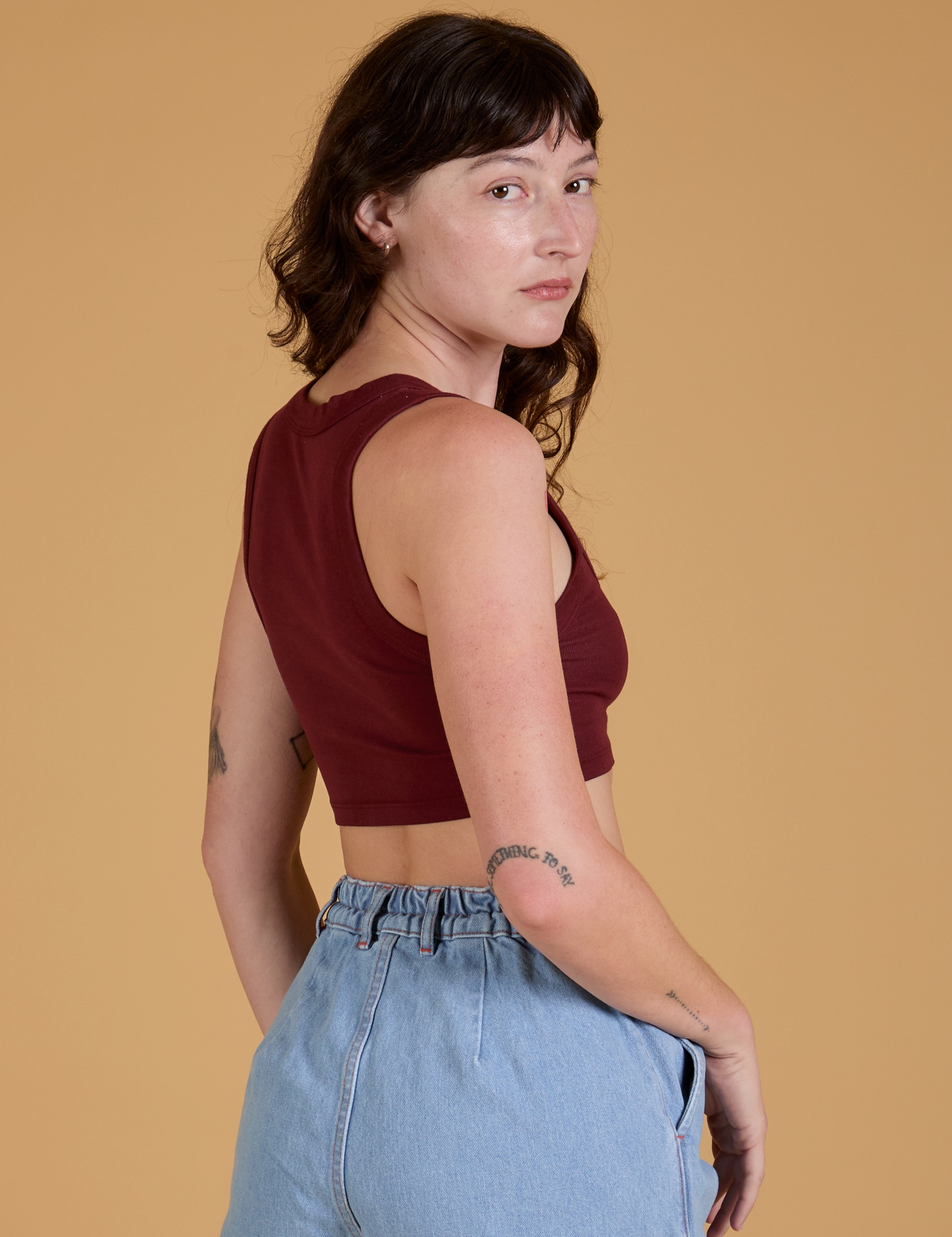 Mini Tank in Red Wine angled back view on Alex