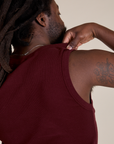 Back shoulder close up of  Muscle Tee in Red Wine on Demi