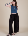 Sydney is wearing Muscle Tee in French Blue paired with black Drop Pocket Cargo Pants