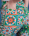 Close up of Alex's hand in the back pocket of Work Pants in Quilt Print