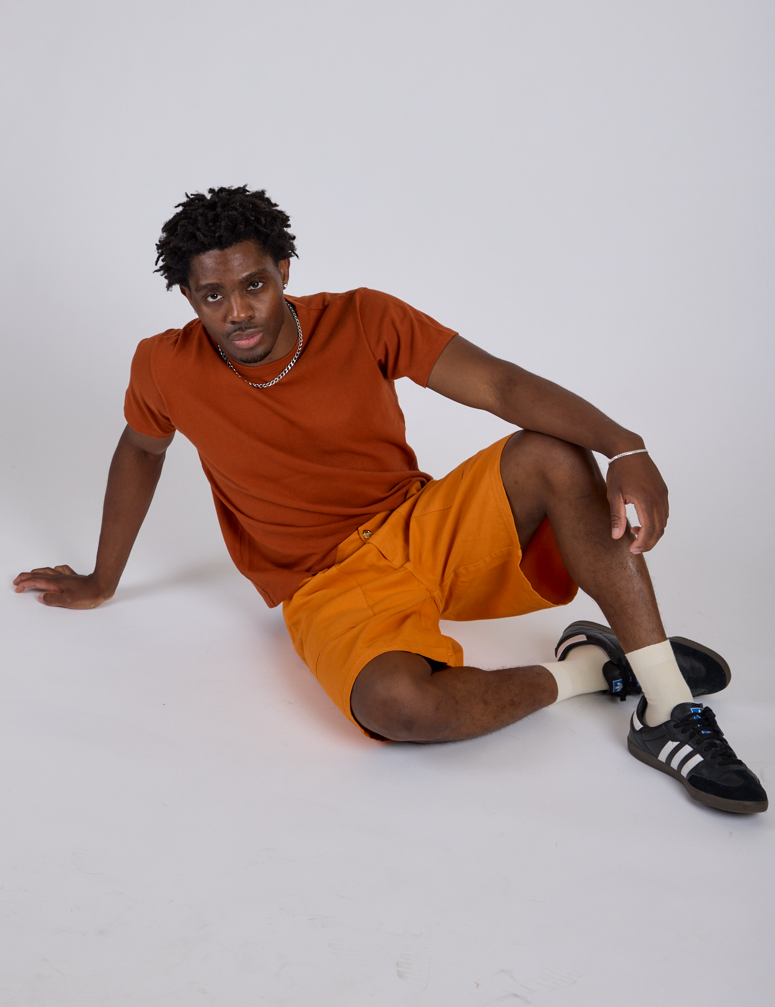 Longline Work Shorts in Creamsicle Orange and burnt terracotta Organic Vintage Tee worn by Isaac