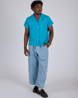 Pantry Button-Up in Hawaiian Blue and light wash Denim Drop Pocket Pants worn by Isaac