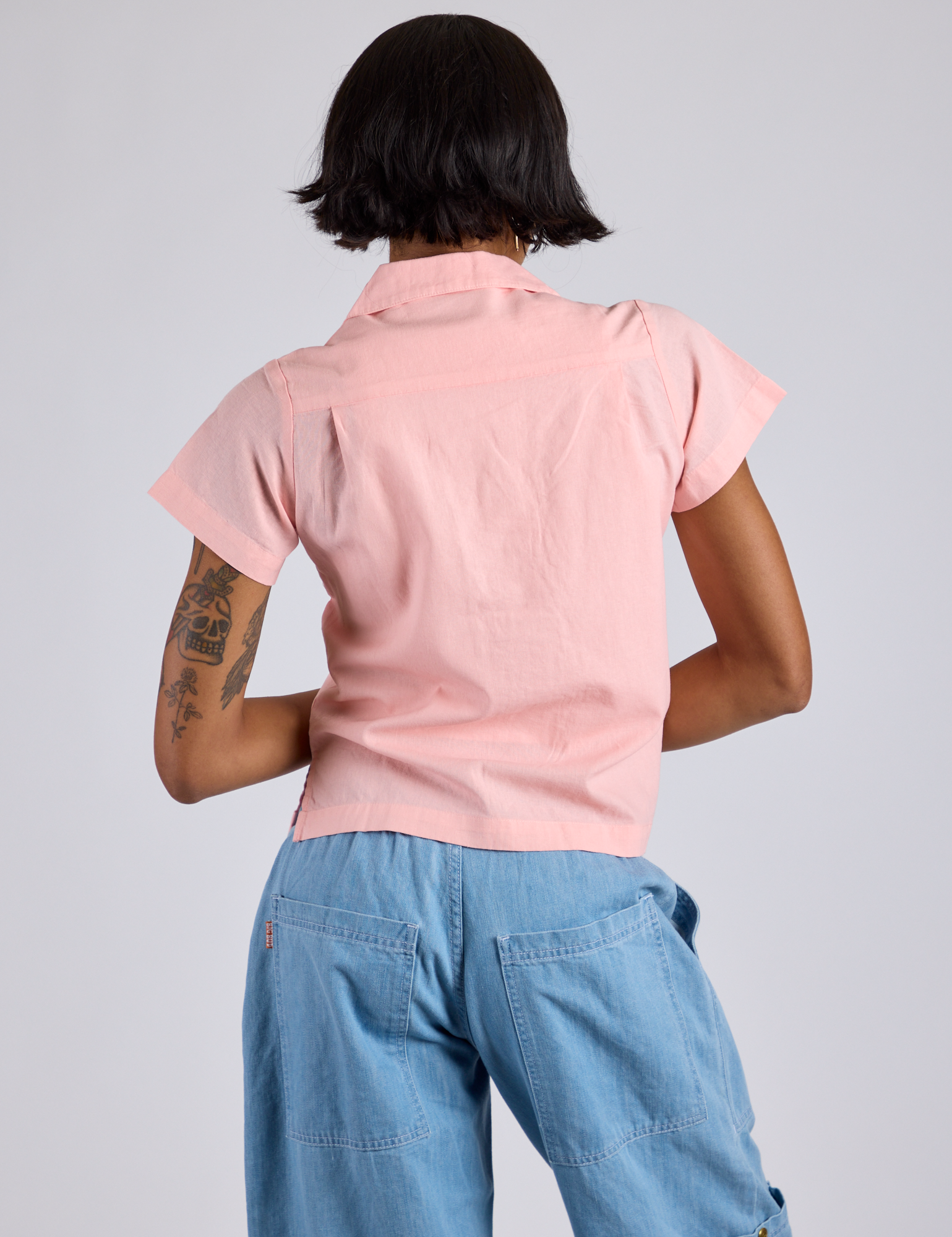 Pantry Button-Up in Baby Pink back view on Kira