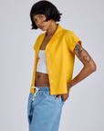 Angled front view of Pantry Button-Up in Sunshine Yellow on Kira