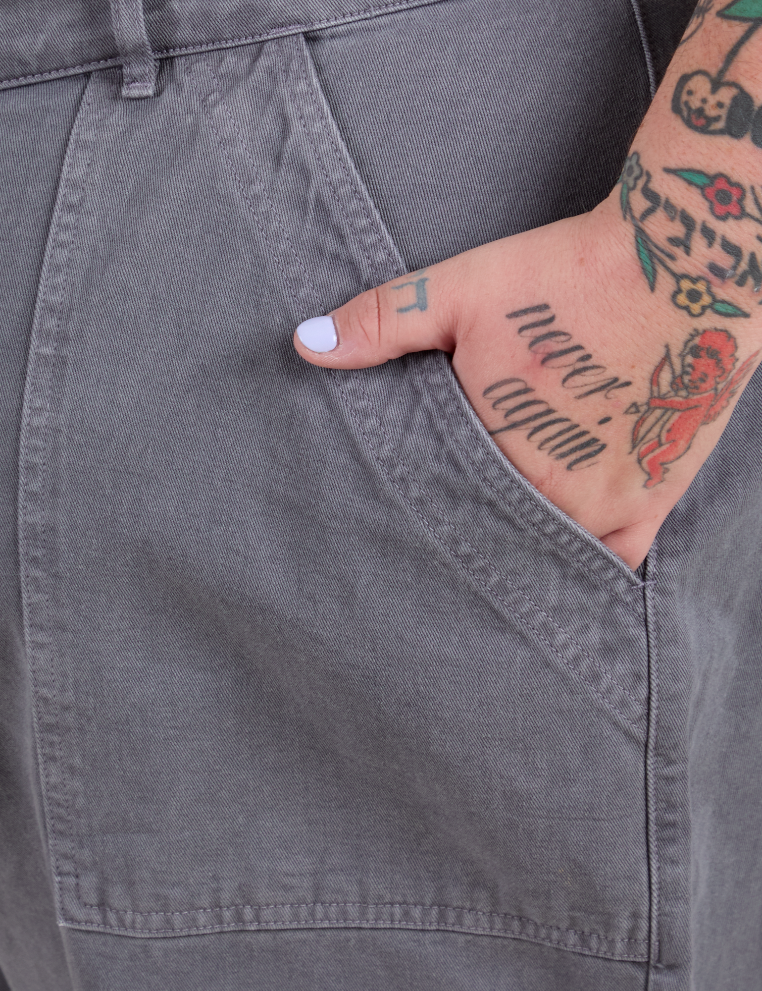 Close up of Sam's hand in the front pocket of Work Pants in Washed Grey