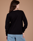 Long Sleeve Burly Tee in Basic Black back view on Alex