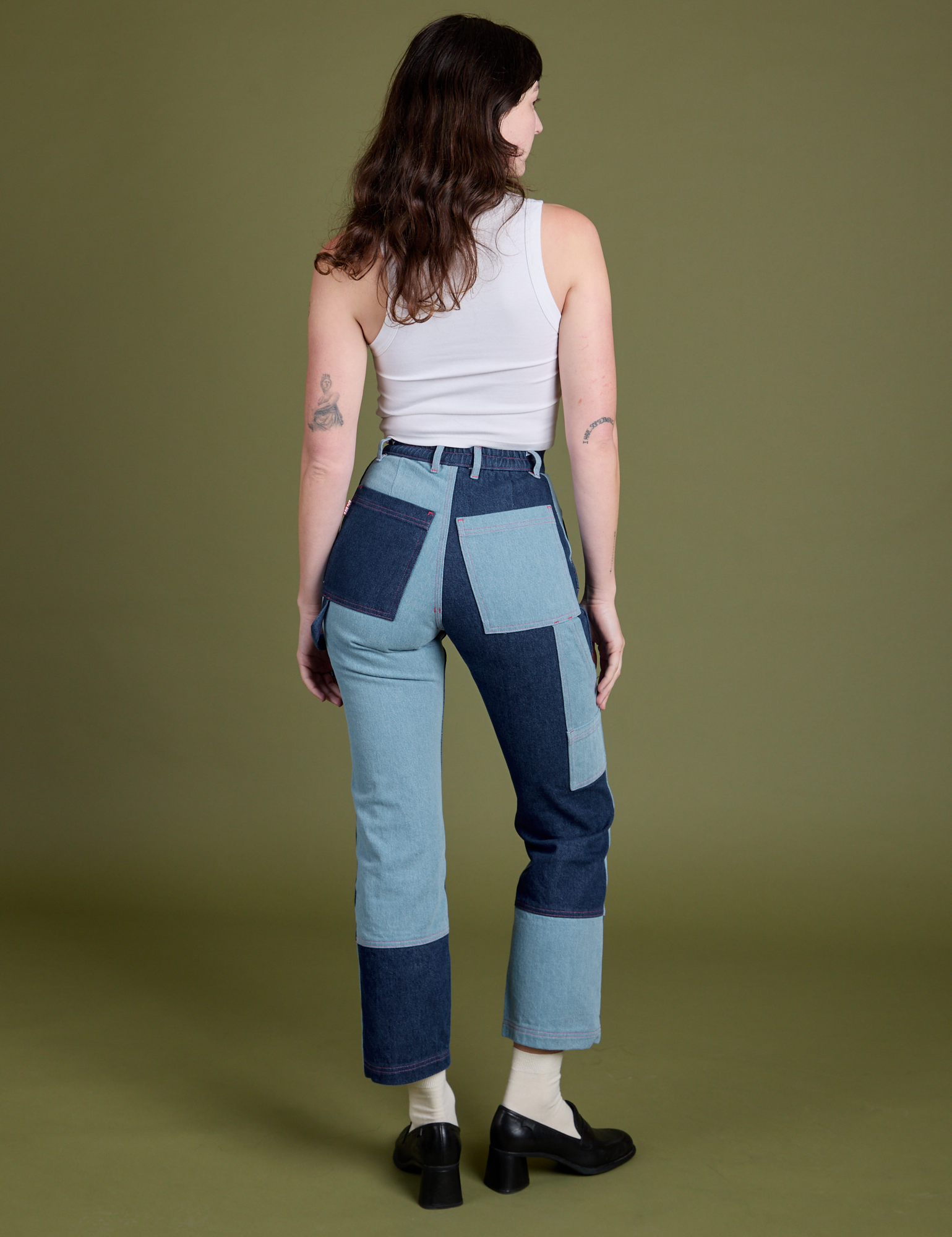 Back view of Mismatched Denim Carpenter Jeans and Cropped Tank in Vintage Tee White on Alex