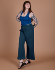 Angled front view of Action Pants in Lagoon and royal blue Cropped Tank