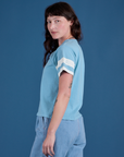 Painted Burly Tee in Baby Blue side view on Alex