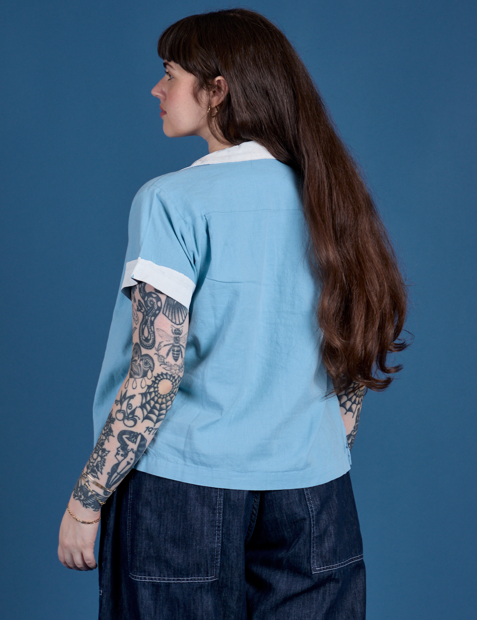 Painted Pantry Button-Up in Baby Blue angled back view on Sydney