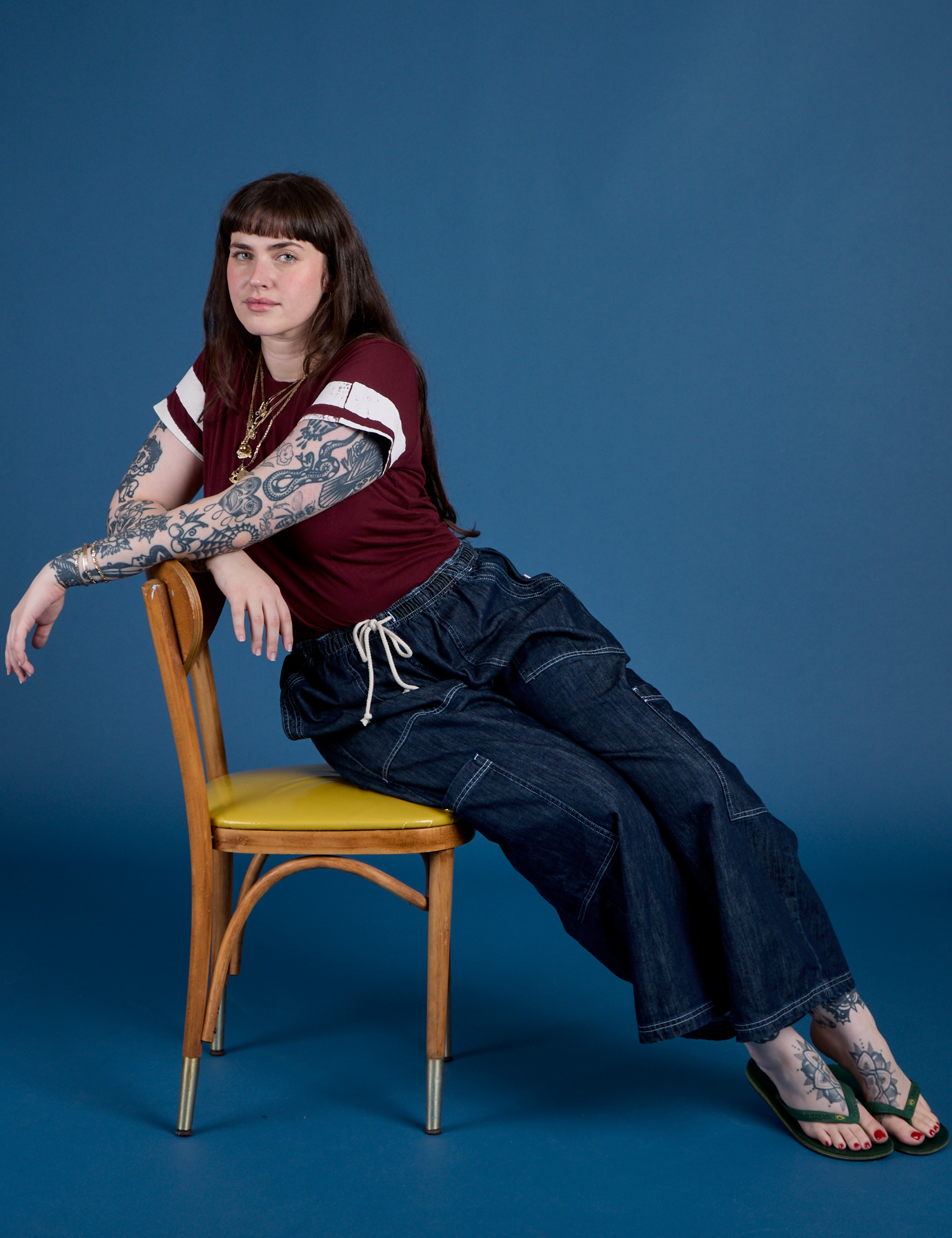 Sydney is wearing Painted Vintage Tee in Red Wine and dark wash Drop Pocket Cargo Pants