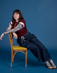 Sydney is wearing Painted Vintage Tee in Red Wine and dark wash Drop Pocket Cargo Pants