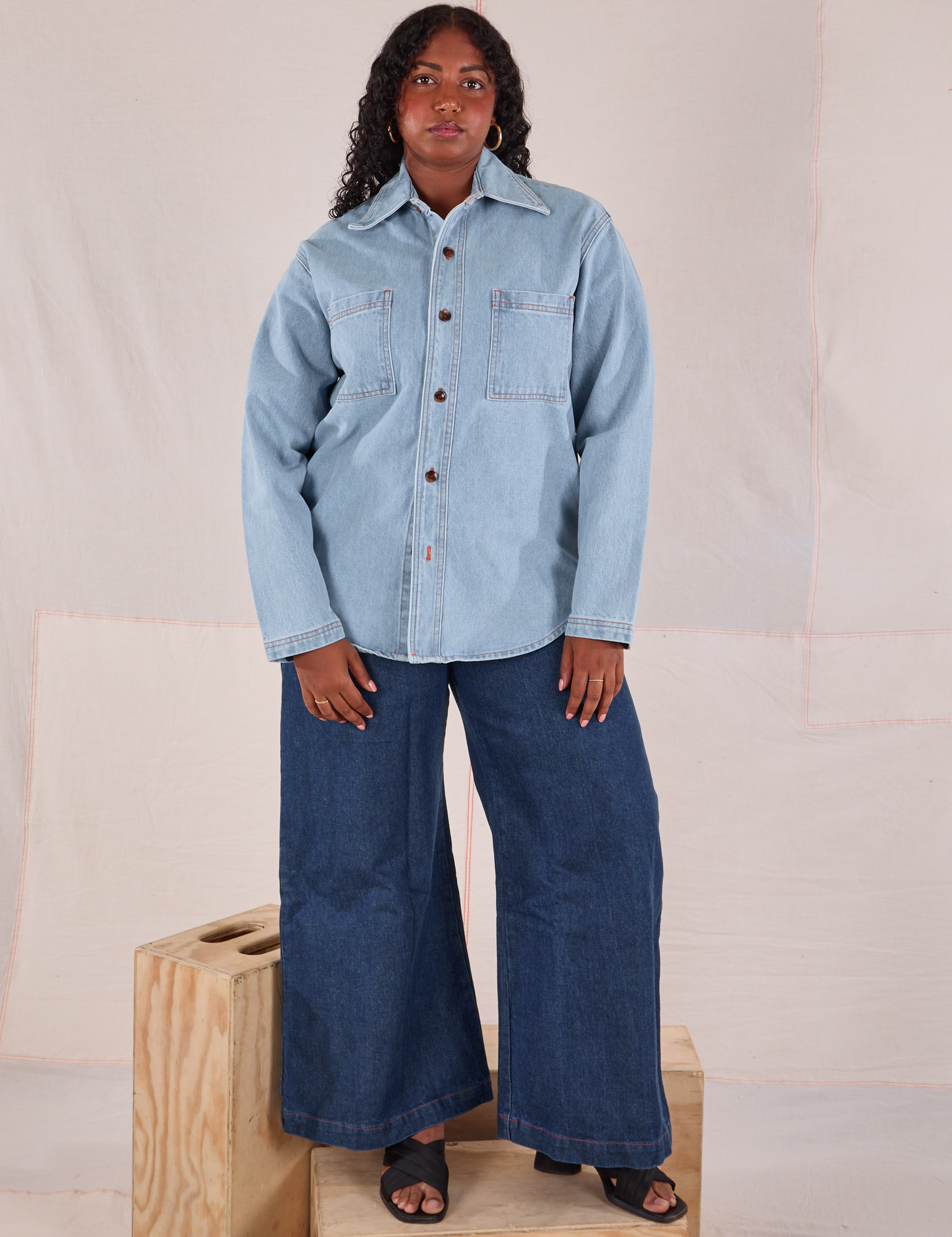 Meghna is wearing Denim Overshirt in Light Wash paired with dark wash Wide Leg Trousers