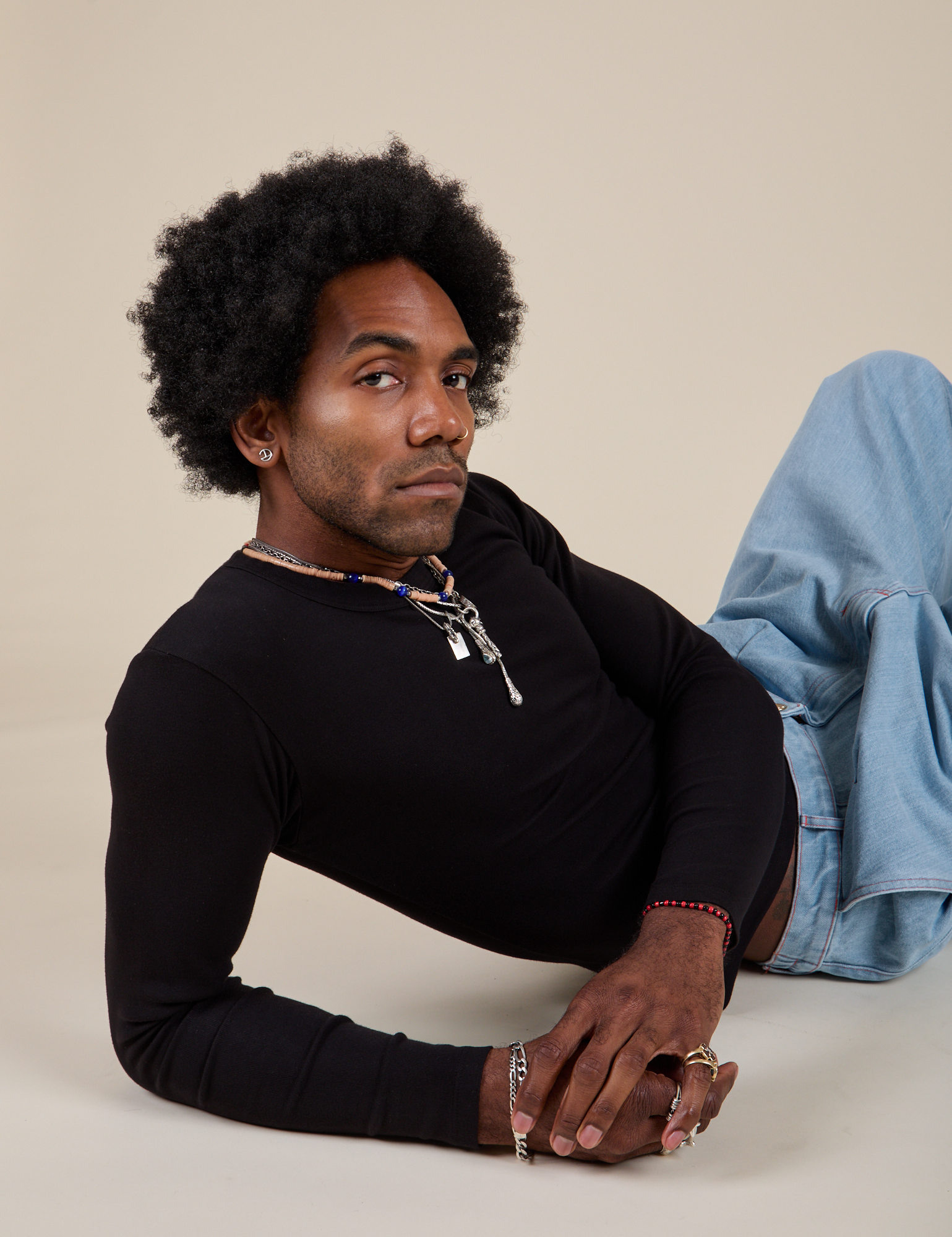 Jerrod is wearing Long Sleeve Baby Tee in Basic Black