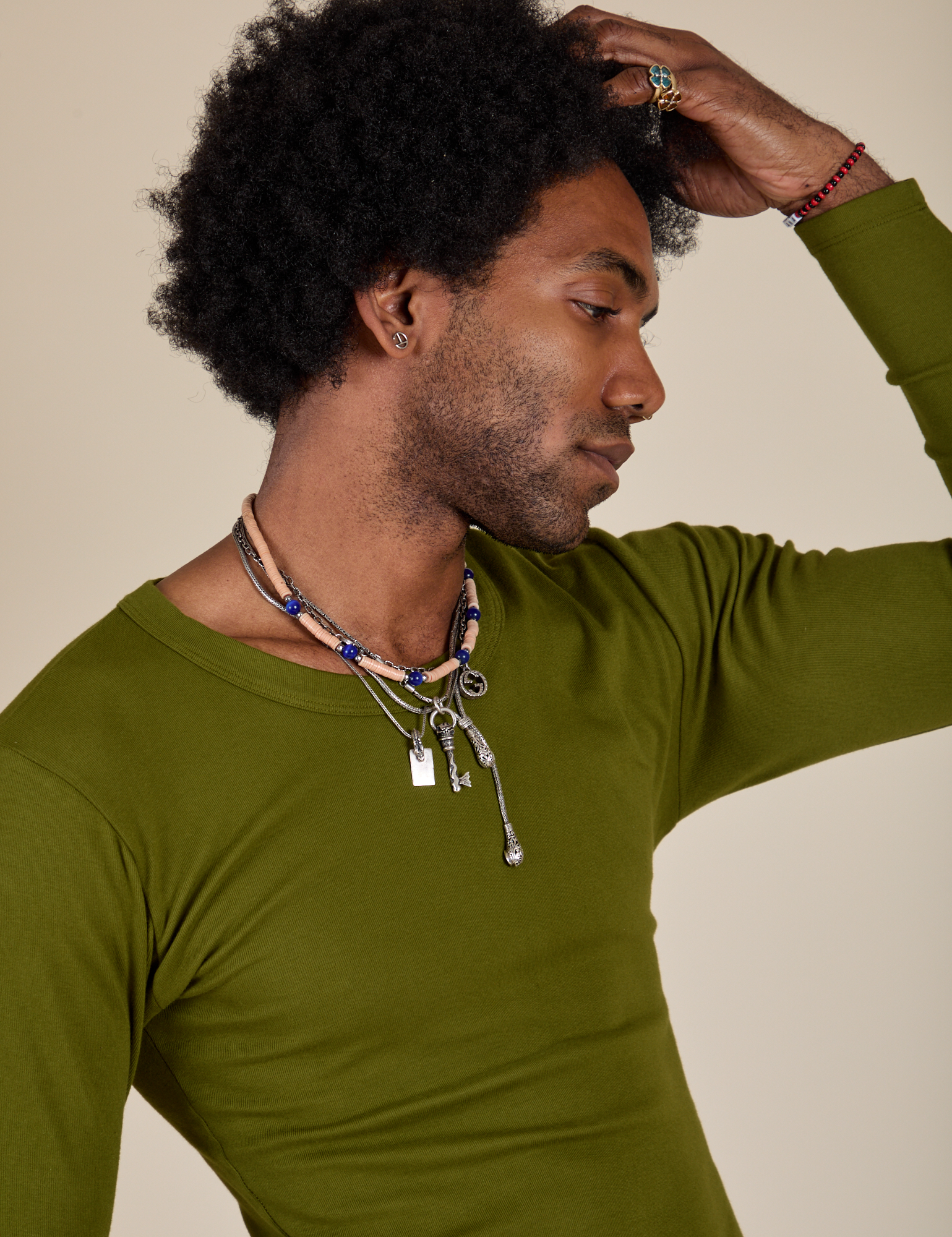Long Sleeve Baby Tee in Summer Olive close up on Jerrod