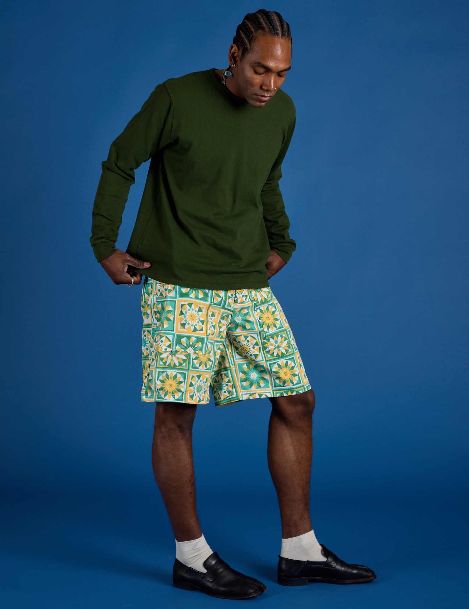 Angled front view of Longline Work Shorts in Spring Quilt Print and Long Sleeve Burly Tee in Evergreen
