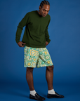 Angled front view of Longline Work Shorts in Spring Quilt Print and Long Sleeve Burly Tee in Evergreen
