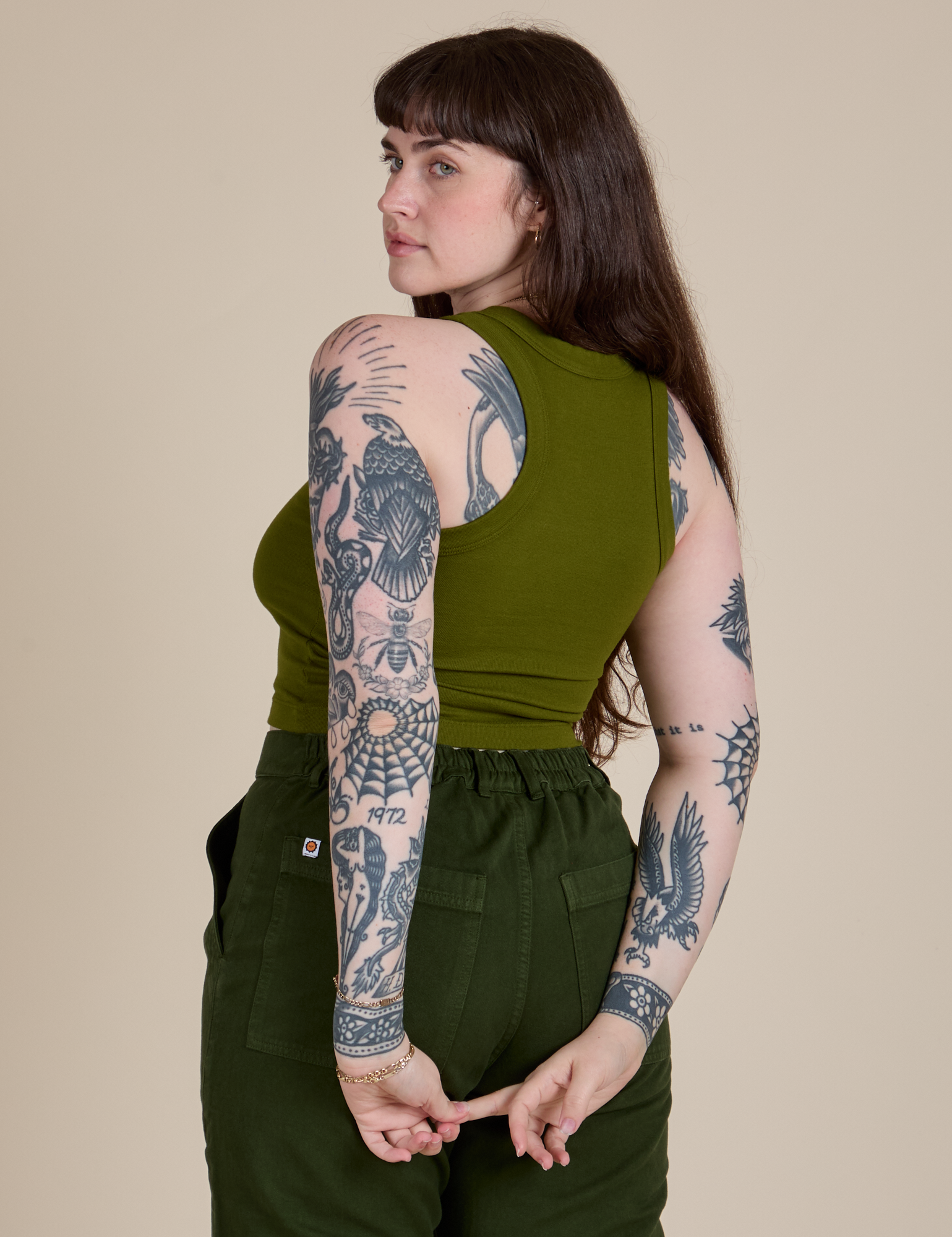 Angled back view of Racerback Tank in Summer Olive on Sydney