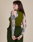 Angled back view of Racerback Tank in Summer Olive on Sydney