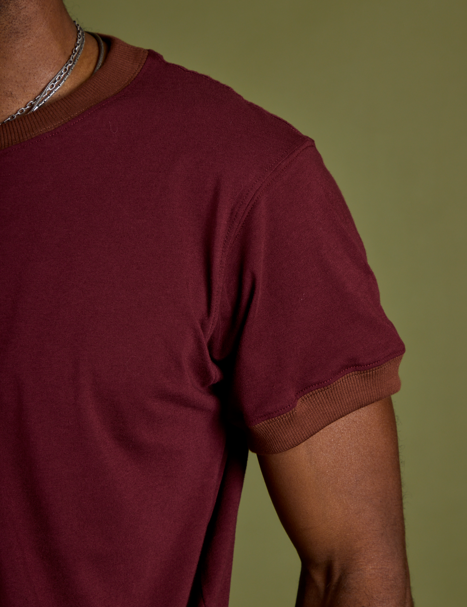 Close up of Vintage Ringer Tee in Red Wine sleeve on Jerrod