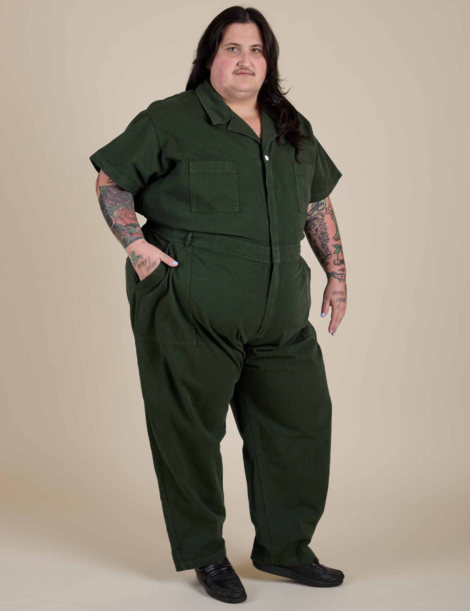 Angled front view of Short Sleeve Jumpsuit in Swamp Green on Sam
