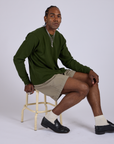 Pleated Trouser Shorts in Khaki Grey and evergreen Long Sleeve Burly Tee worn by Jerrod