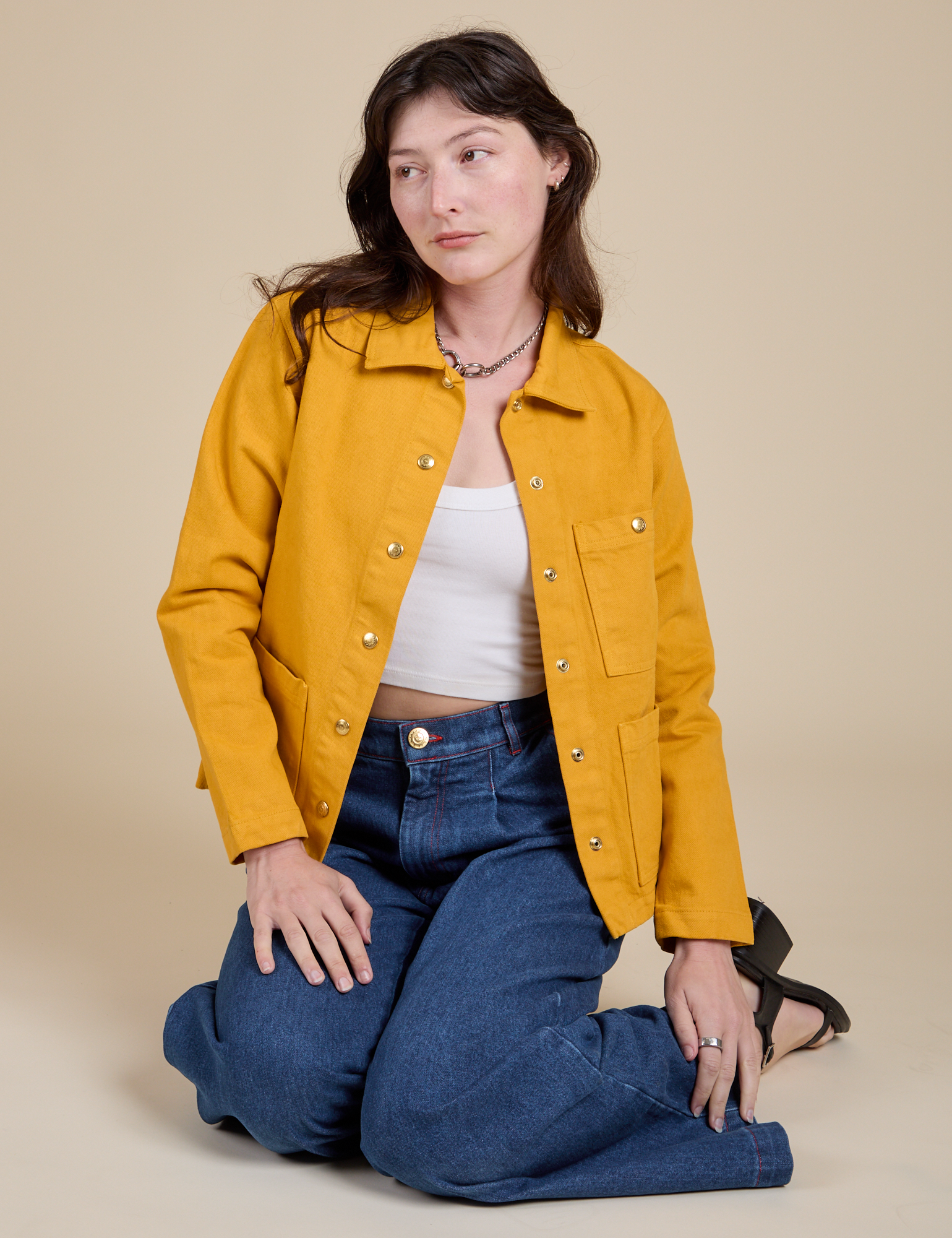 Alex is wearing Denim Work Jacket in Mustard Yellow