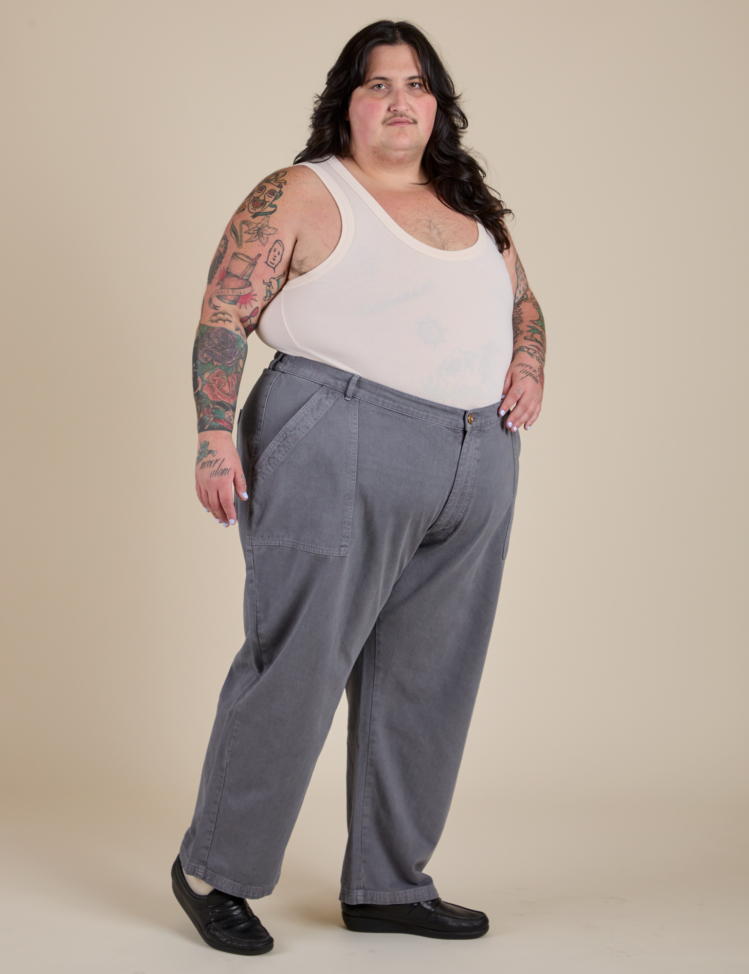 Angled front view of Work Pants in Washed Grey and Tank Top in Vintage Tee Off-White on Sam