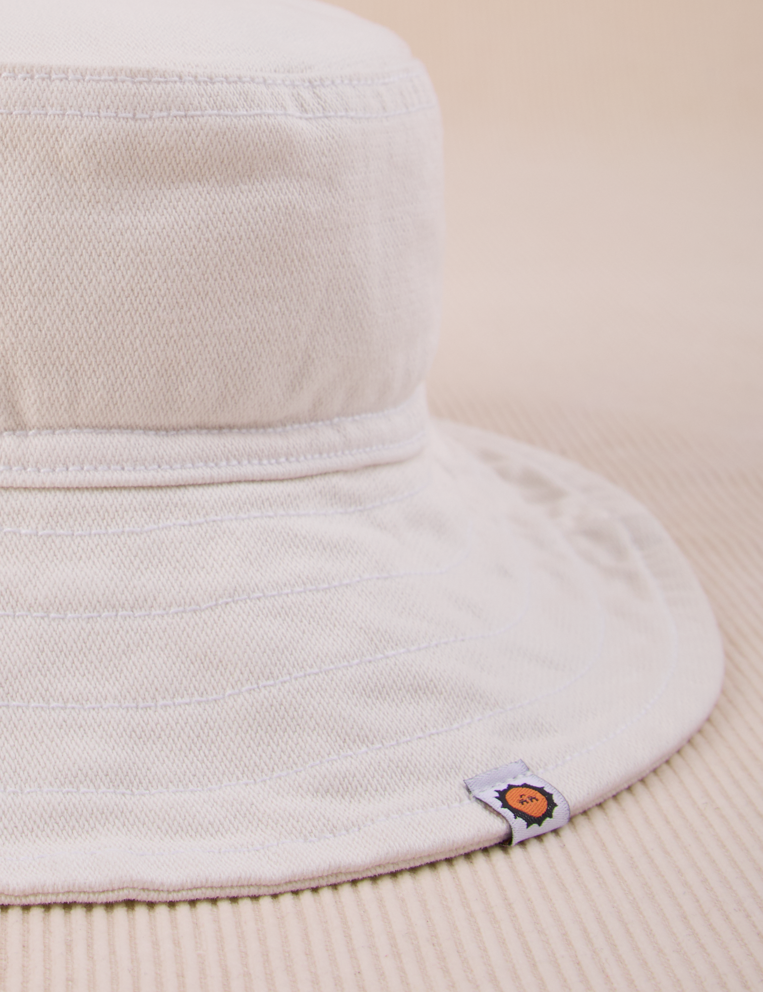 Wide Brim Denim Bucket Hats in Vintage Tee Off-White close up