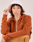 Tiara is wearing Wide Brim Denim Bucket Hats in Vintage Tee Off-White