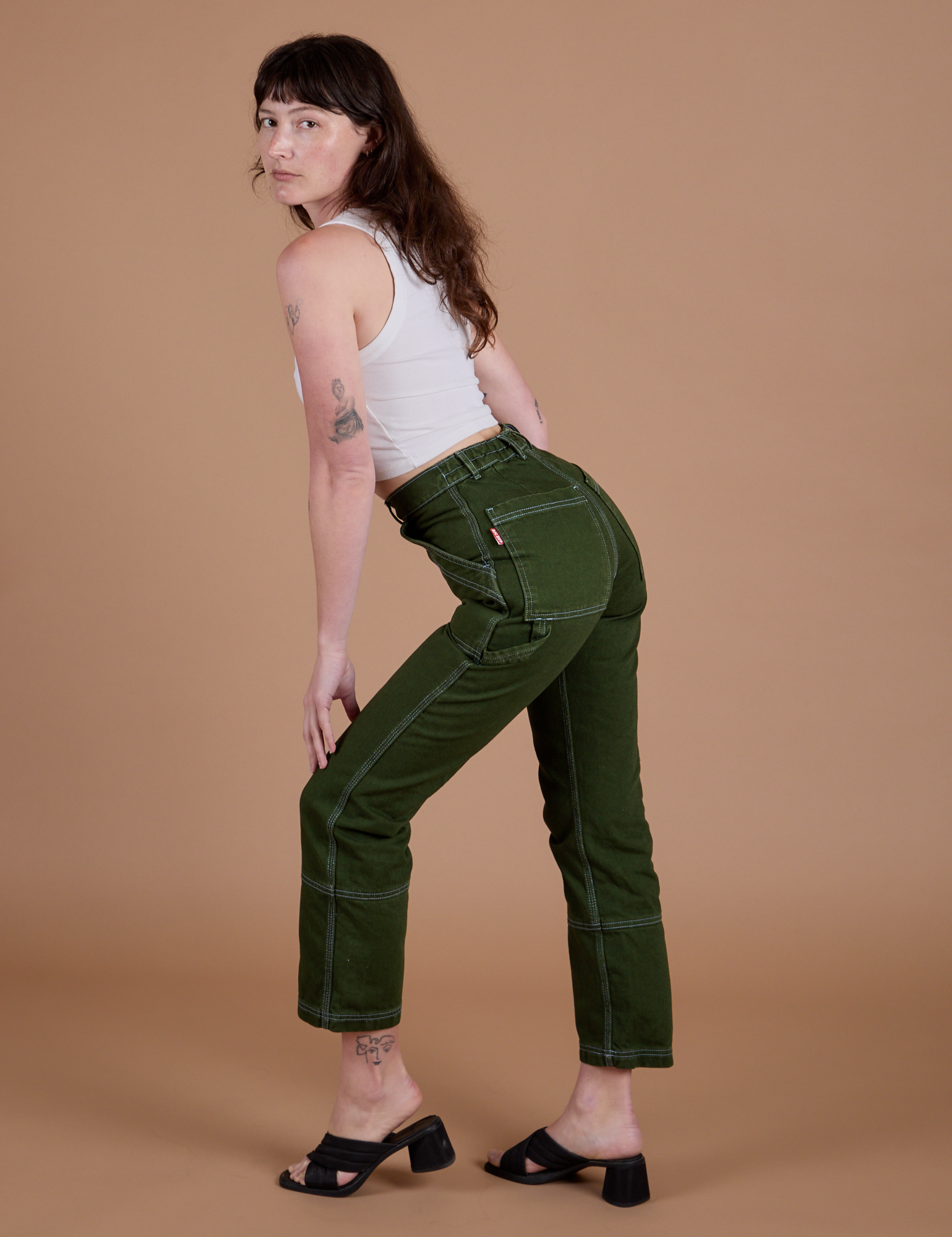 Carpenter Jeans in Evergreen side view on Alex