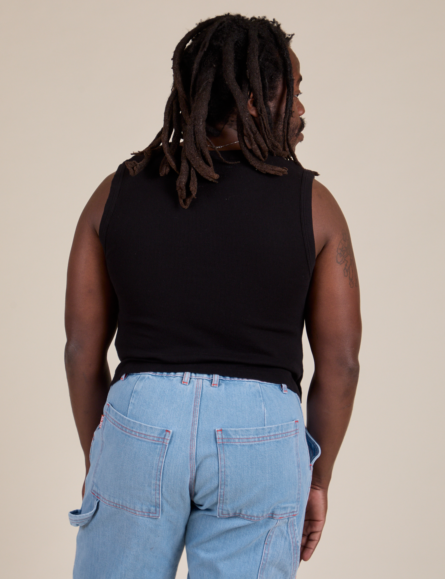 Muscle Tee in Basic Black back view on Demi