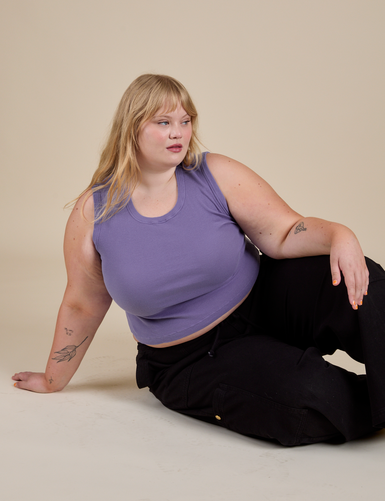 Juliet is wearing Muscle Tee in Faded Grape