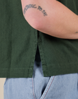 Close up side vent of Pantry Button-Up in Swamp Green on Alex