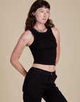 Racerback Tank in Black angled front view on Alex